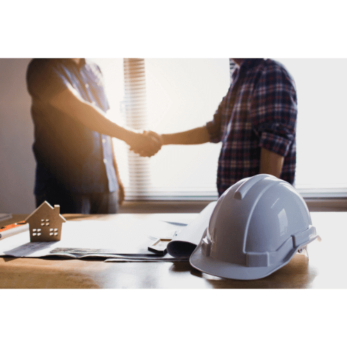 cas que de chantier figurine maison et deux personnes qui se serrent la main